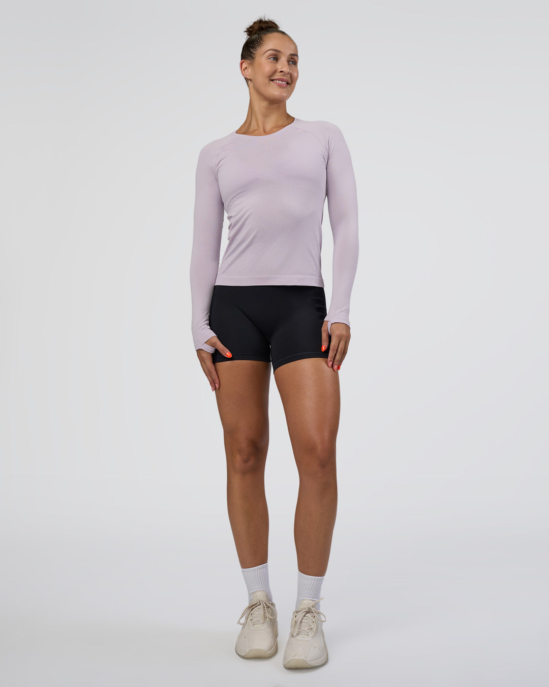 Woman wearing AeroFLX+ Seamless Long Sleeve Tee - Fair Orchid/Fair Orchid | Model:Abbey | Size:S