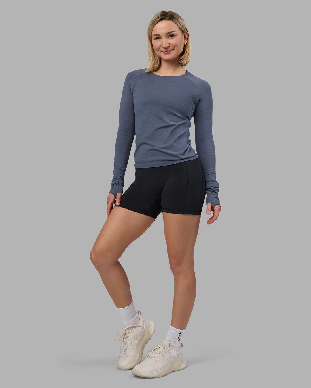 Woman wearing AeroFLX+ Seamless Long Sleeve Tee - Night Shadow/Night Shadow | Model:Halle | Size:S