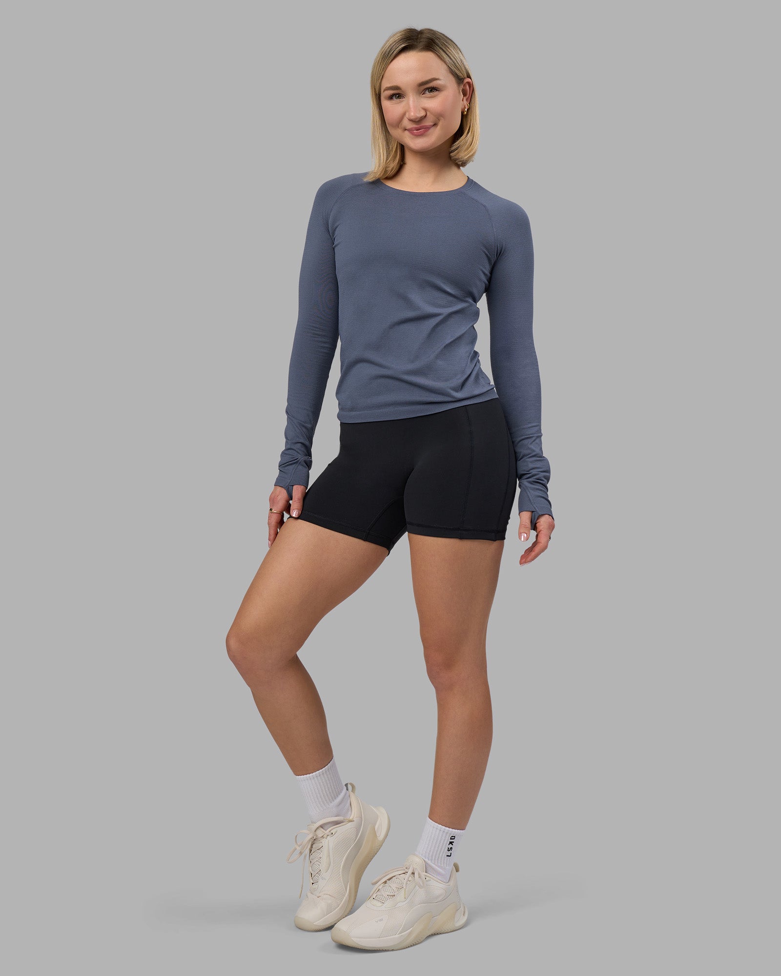 Woman wearing AeroFLX+ Seamless Long Sleeve Tee - Night Shadow/Night Shadow | Model:Halle | Size:S