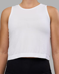 Woman wearing AeroFLX+ Seamless Skimmer Tank - White/White | Model:Charlize | Size:S