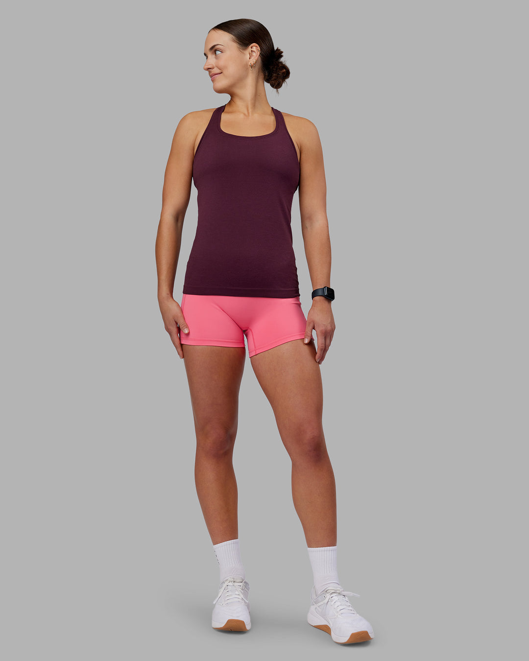 Woman wearing AeroFLX+ Seamless Tank - Cherry Lacquer/Cherry Lacquer | Model:Keisha | Size:S