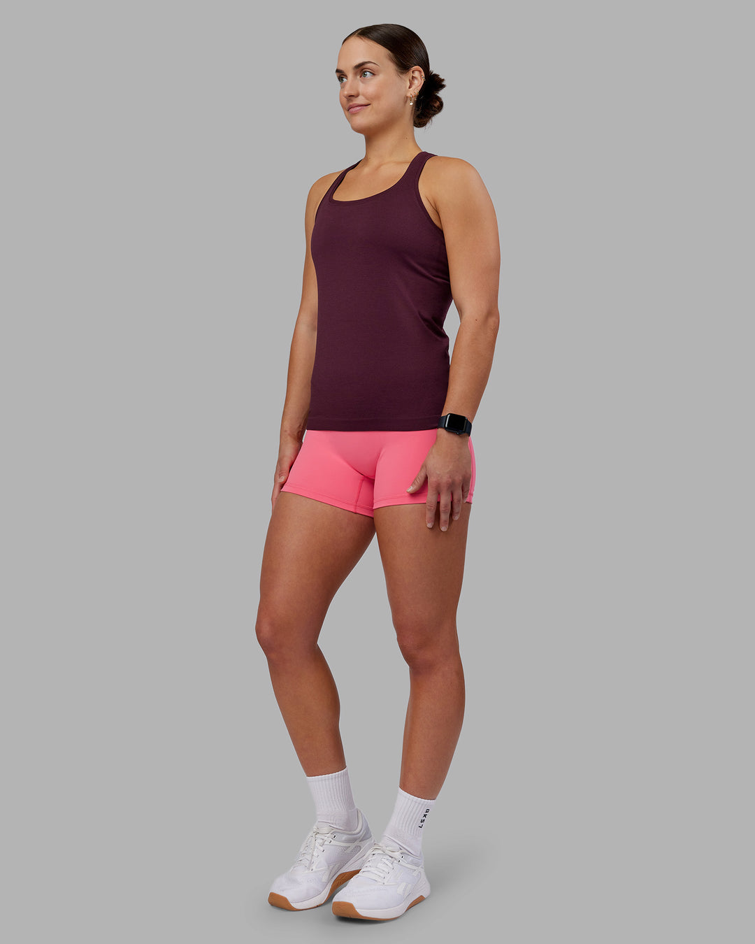 Woman wearing AeroFLX+ Seamless Tank - Cherry Lacquer/Cherry Lacquer | Model:Keisha | Size:S