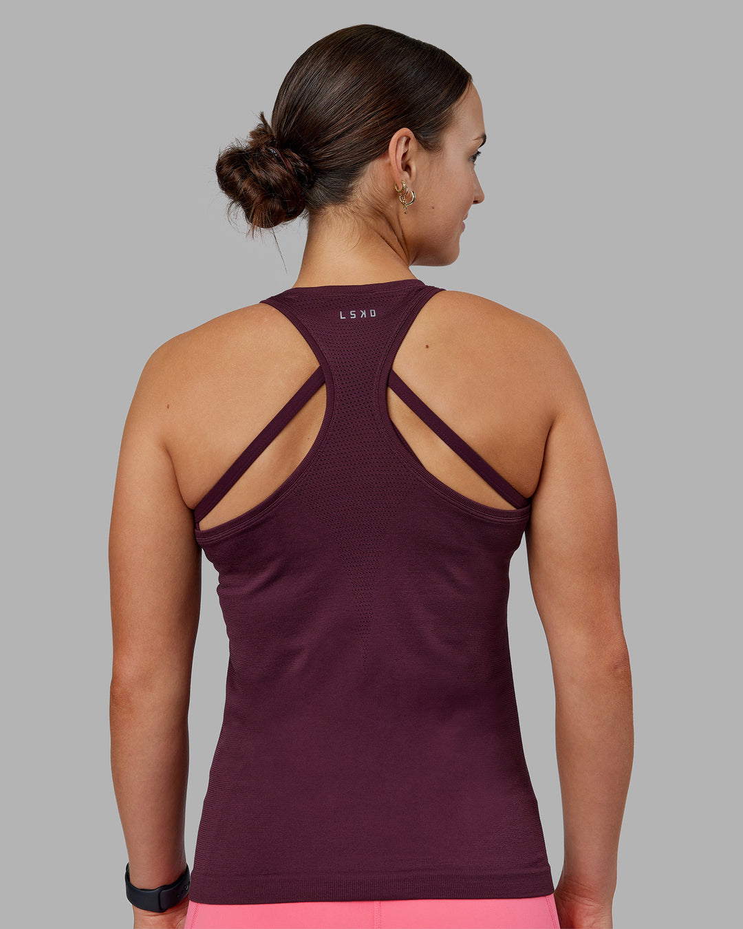 Woman wearing AeroFLX+ Seamless Tank - Cherry Lacquer/Cherry Lacquer | Model:Keisha | Size:S