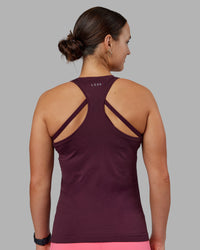Woman wearing AeroFLX+ Seamless Tank - Cherry Lacquer/Cherry Lacquer | Model:Keisha | Size:S