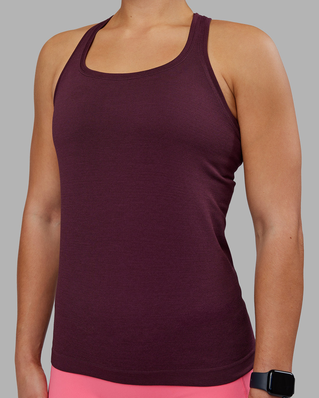 Woman wearing AeroFLX+ Seamless Tank - Cherry Lacquer/Cherry Lacquer | Model:Keisha | Size:S