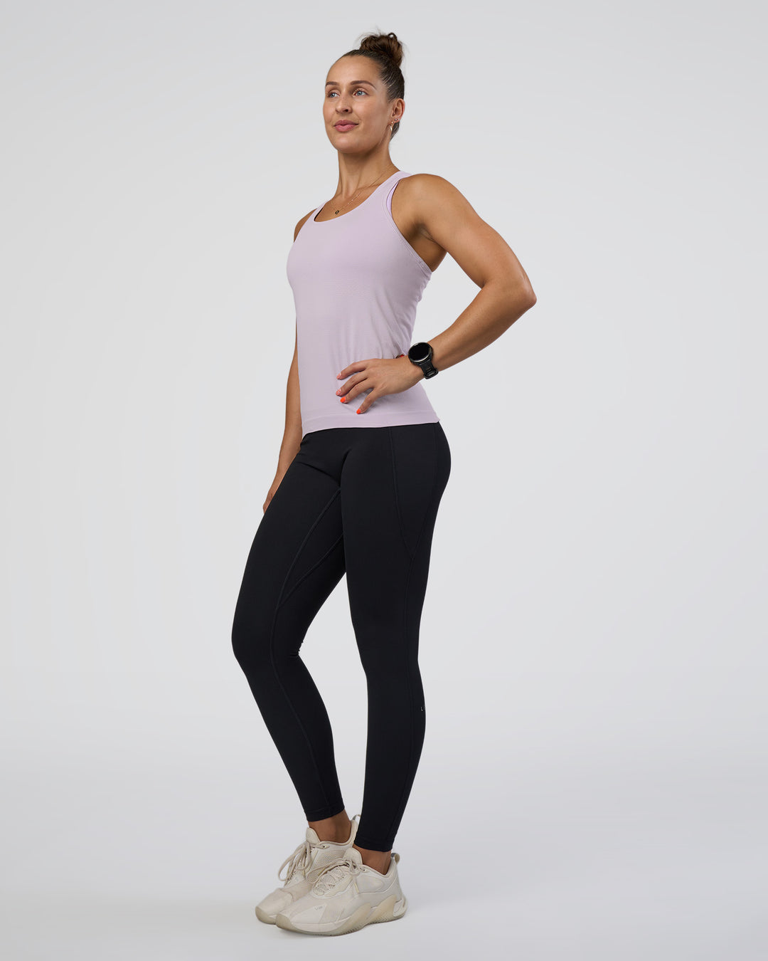 Woman wearing AeroFLX+ Seamless Tank - Fair Orchid/Fair Orchid | Model:Abbey | Size:S