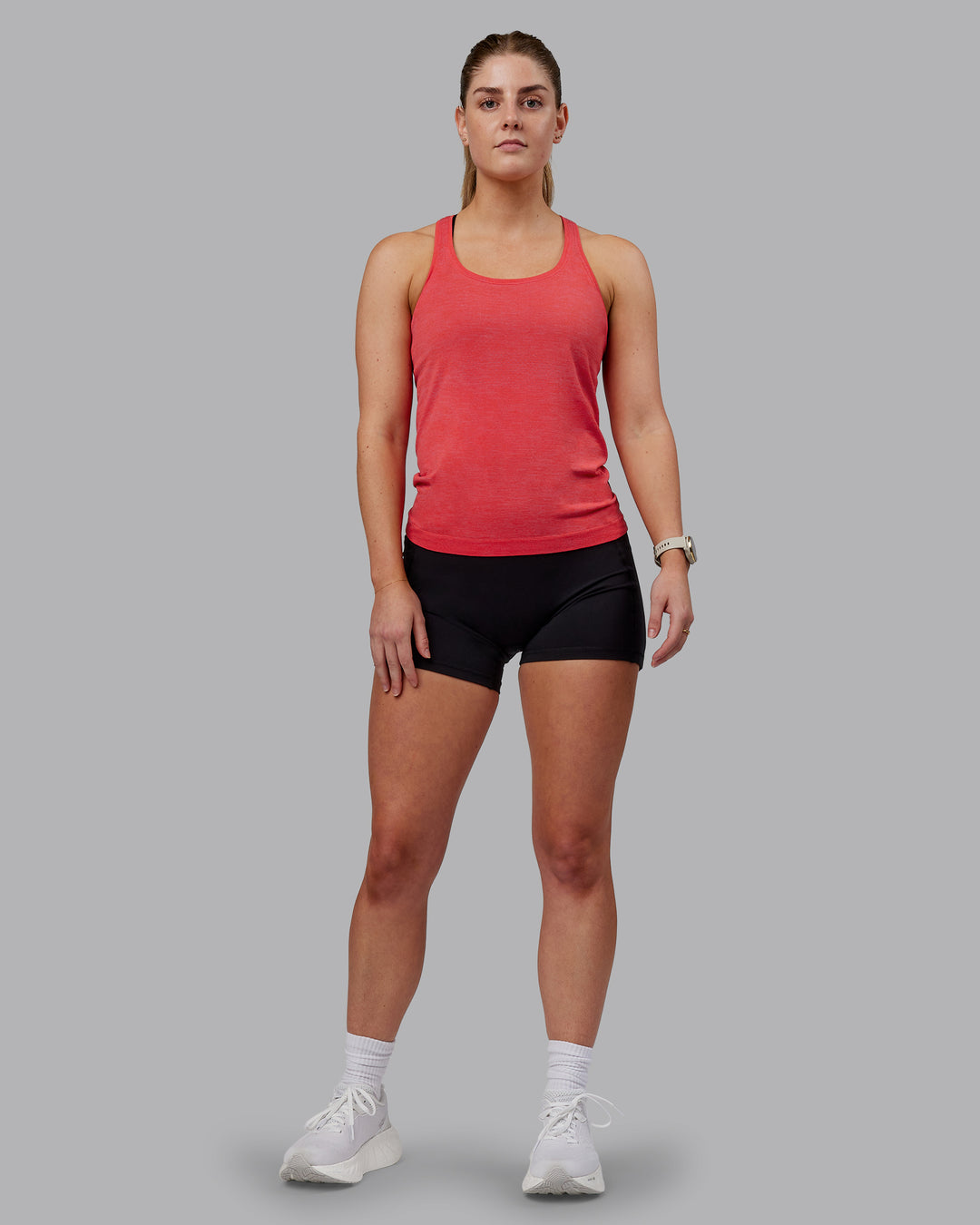 Woman wearing AeroFLX+ Seamless Tank - Fuchsia Pink-Grenadine