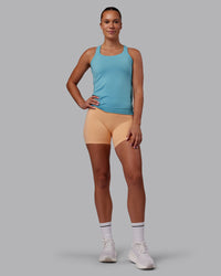 Woman wearing AeroFLX+ Seamless Tank - Retro Blue/Retro Blue | Model:Charlize | Size:S