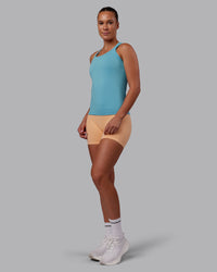 Woman wearing AeroFLX+ Seamless Tank - Retro Blue/Retro Blue | Model:Charlize | Size:S