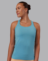 Woman wearing AeroFLX+ Seamless Tank - Retro Blue/Retro Blue | Model:Charlize | Size:S