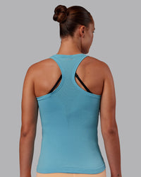 Woman wearing AeroFLX+ Seamless Tank - Retro Blue/Retro Blue | Model:Charlize | Size:S