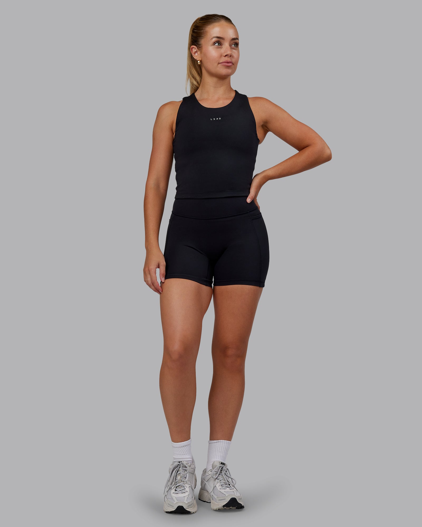 Woman wearing Base Tank - Black | Size:S | Model:Hannah