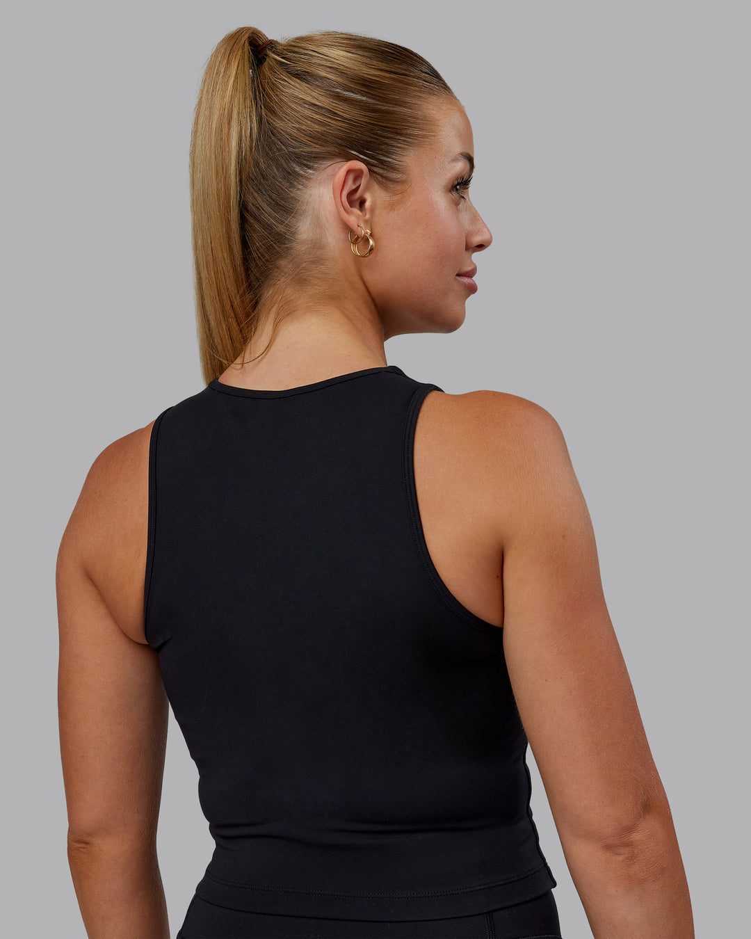 Woman wearing Base Tank - Black | Size:S | Model:Hannah