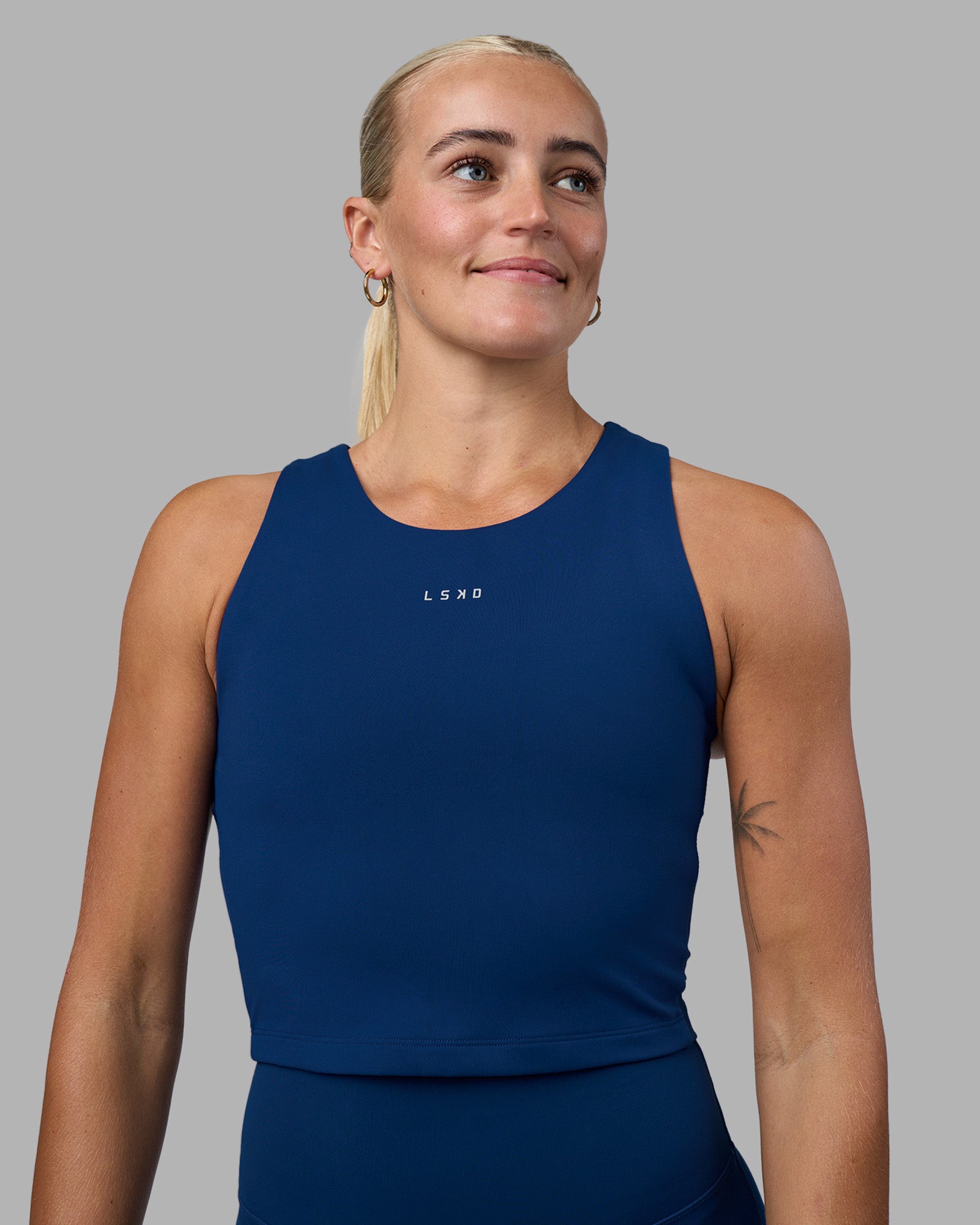 Woman wearing Base Tank - Midnight Blue | Model:Katie | Size:S