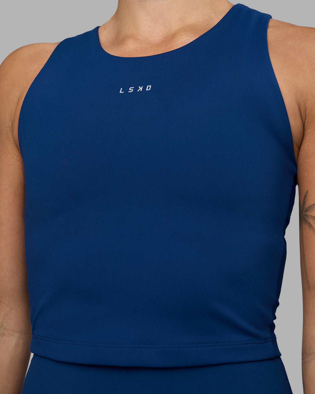 Woman wearing Base Tank - Midnight Blue | Model:Katie | Size:S