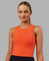 Woman wearing Base Tank - Ultra Orange | Model:Ella | Size:S