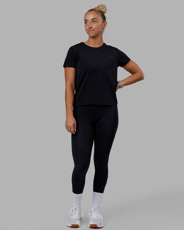 Woman wearing Endeavour FLX Cotton Tee - Black-Black