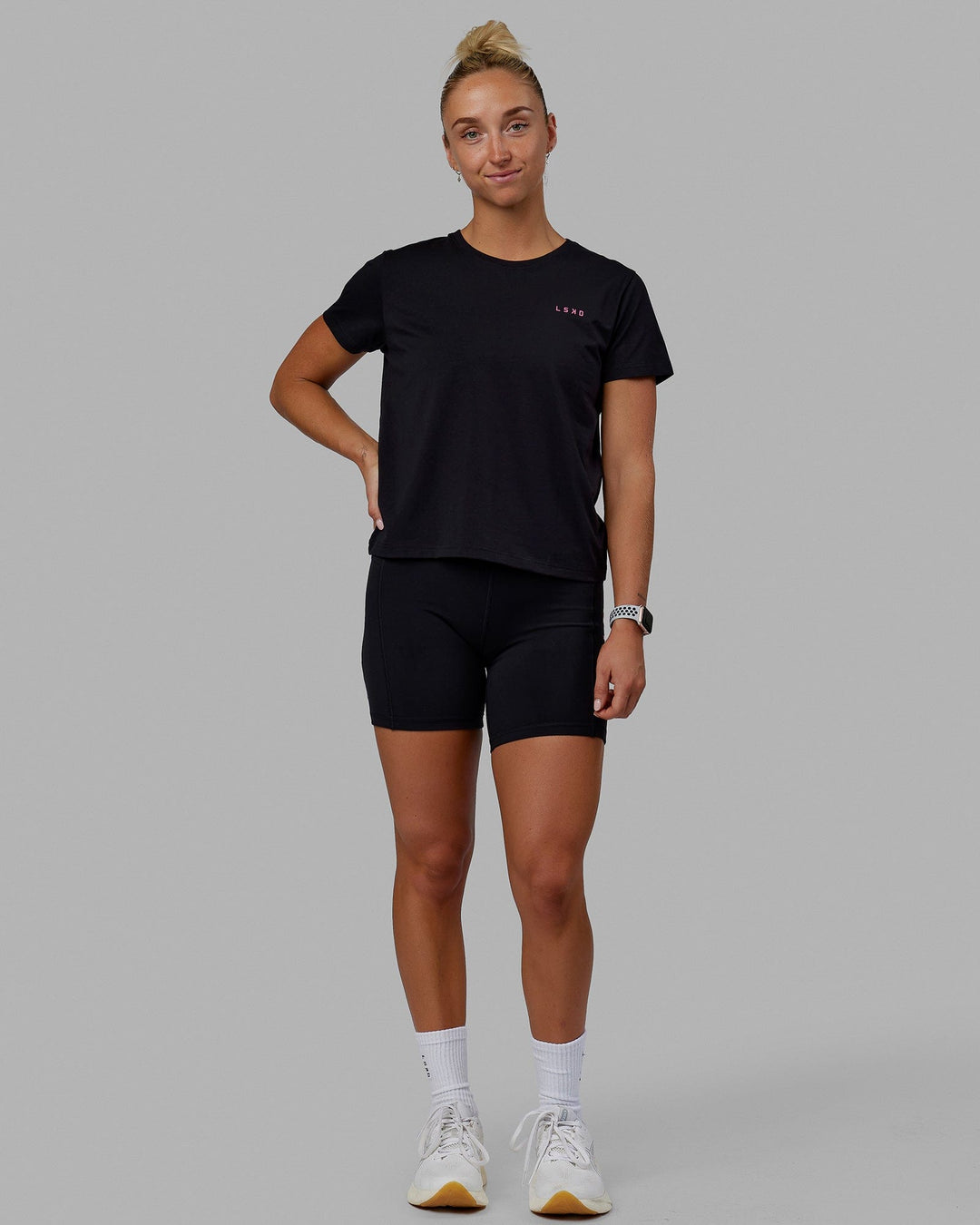 Woman wearing Endeavour FLX Cotton Tee - Black-Magenta