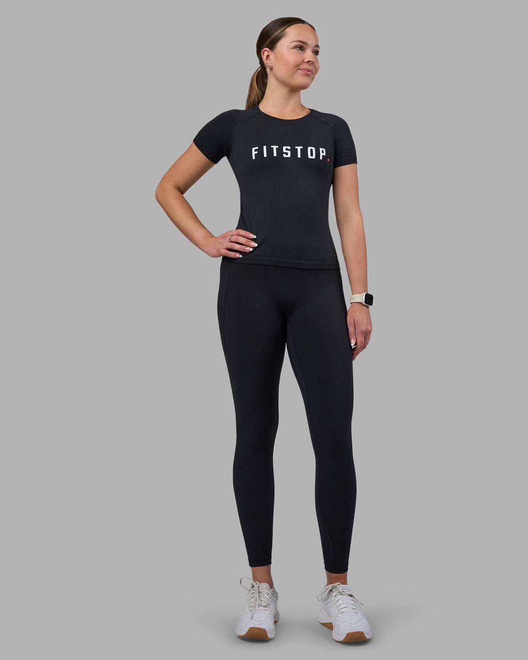 Woman wearing Fitstop AeroFLX+ Seamless Tee - Black | Model:Jade | Size:S