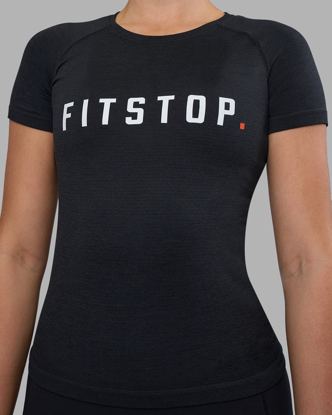 Woman wearing Fitstop AeroFLX+ Seamless Tee - Black | Model:Jade | Size:S