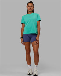 Woman wearing Love The Run FLXCotton Tee - Aquatic Awe-White
