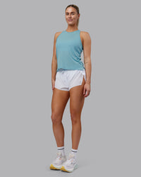 Woman wearing Pace Running Tank - Retro Blue | Model:Hannah | Size:S
