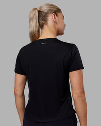Woman wearing Pace Running Tee - Black | Model:Hannah | Size:S
