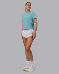 Woman wearing Pace Running Tee - Retro Blue | Model:Hannah | Size:S