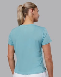 Woman wearing Pace Running Tee - Retro Blue | Model:Hannah | Size:S