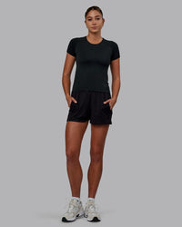 Women Wearing Restore CloudFLX Short - Black | Thumbnail Index: 1