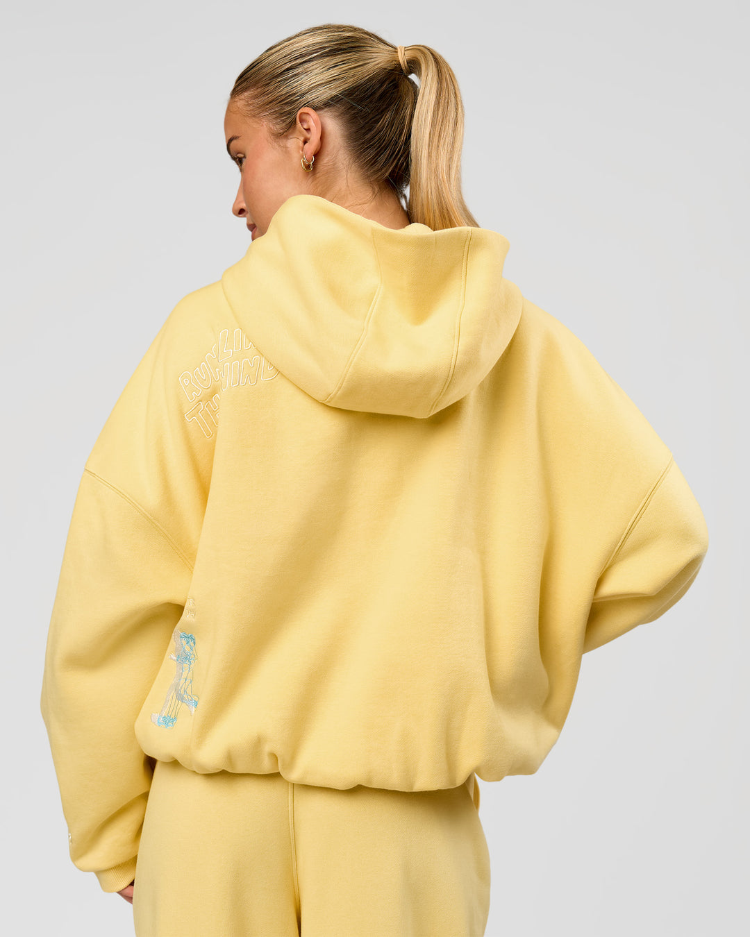 Woman wearing Zola Oversized Hoodie - Lemon | Model:Issy | Size:S