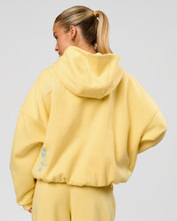 Woman wearing Zola Oversized Hoodie - Lemon | Model:Issy | Size:S