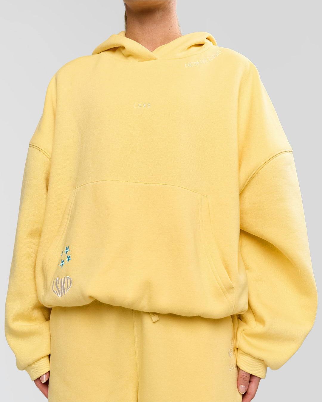 Woman wearing Zola Oversized Hoodie - Lemon | Model:Issy | Size:S