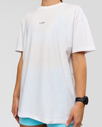 Woman wearing Run Like The Wind FLXCotton Oversized Tee - White-Future Navy | Model:Grace | Size:S