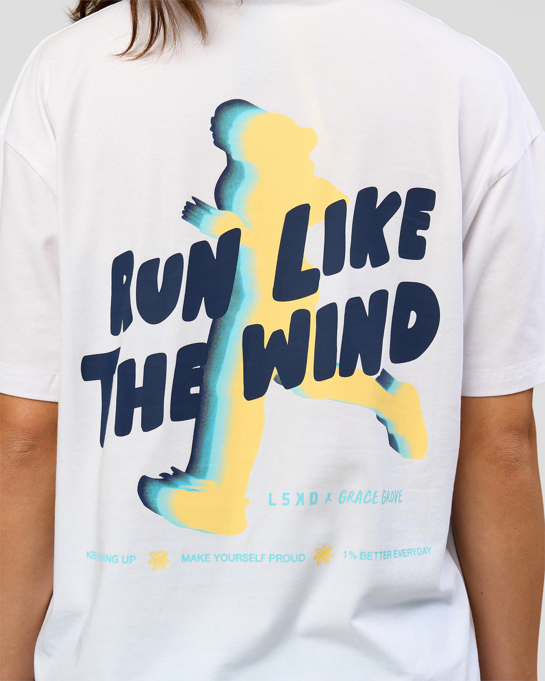 Woman wearing Run Like The Wind FLXCotton Oversized Tee - White-Future Navy | Model:Grace | Size:S