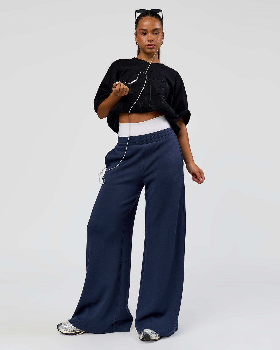 Woman wearing 86 V-Neck Oversized Tee - Black-Black | Model:Sophia | Size:S |