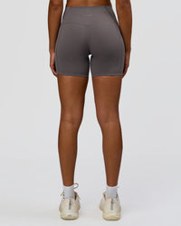 Woman wearing Bend High-Rise 4" Short - Duskstone | Model:Rosie | Size:S
