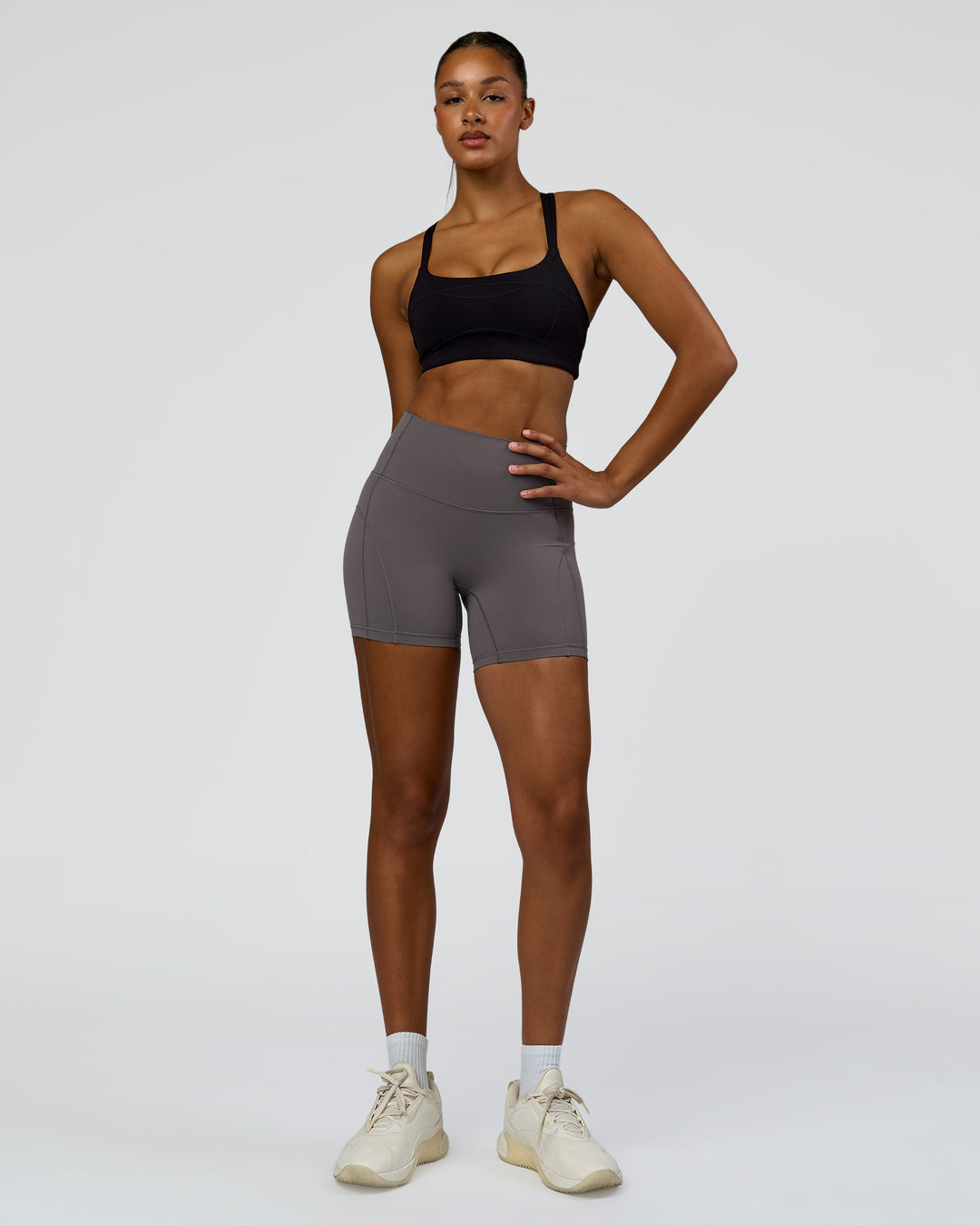 Woman wearing Inertia Sports Bra - Black | Model:Rosie | Size:S