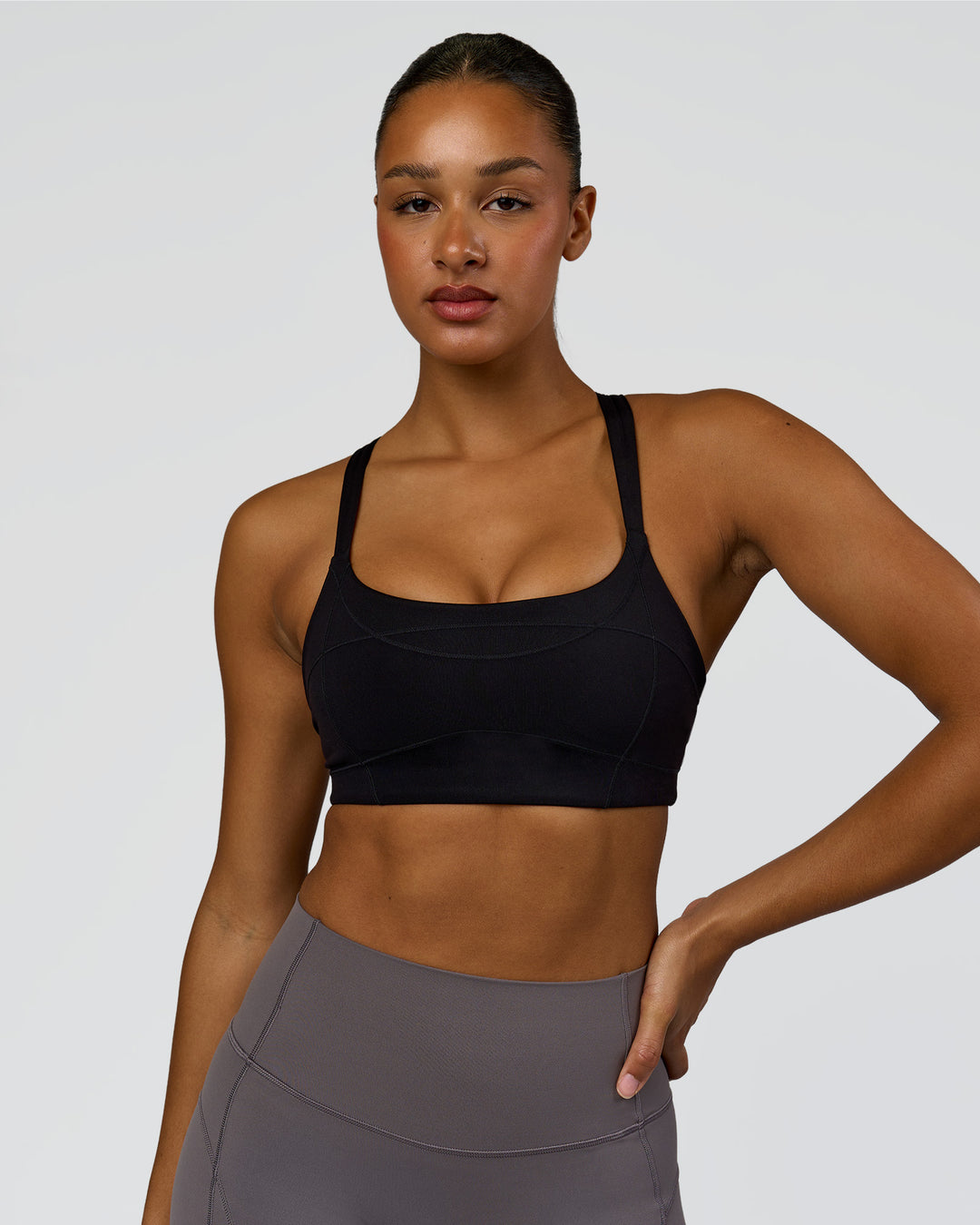 Woman wearing Inertia Sports Bra - Black | Model:Rosie | Size:S