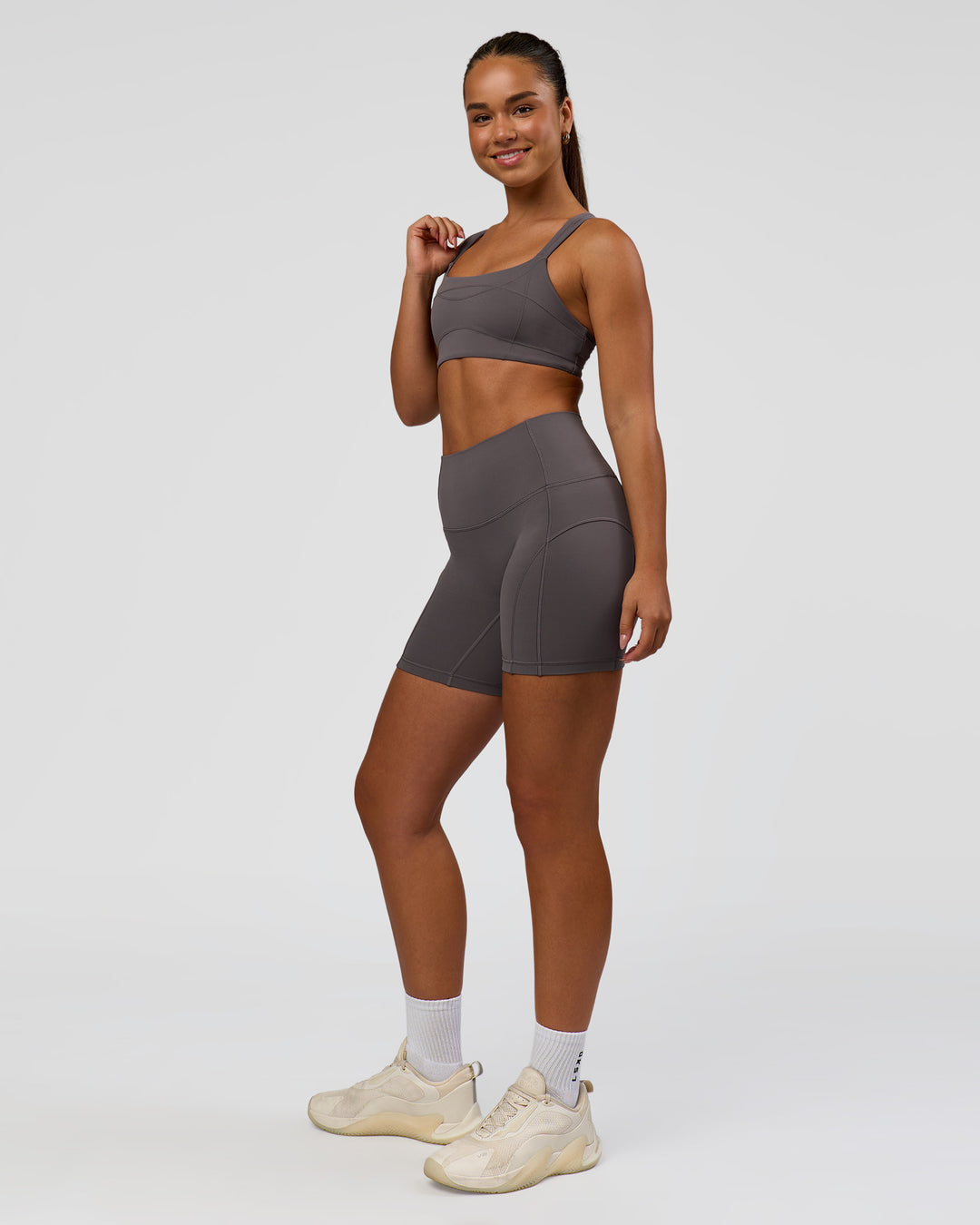 Woman wearing Inertia Sports Bra - Duskstone | Model:Rosie | Size:S