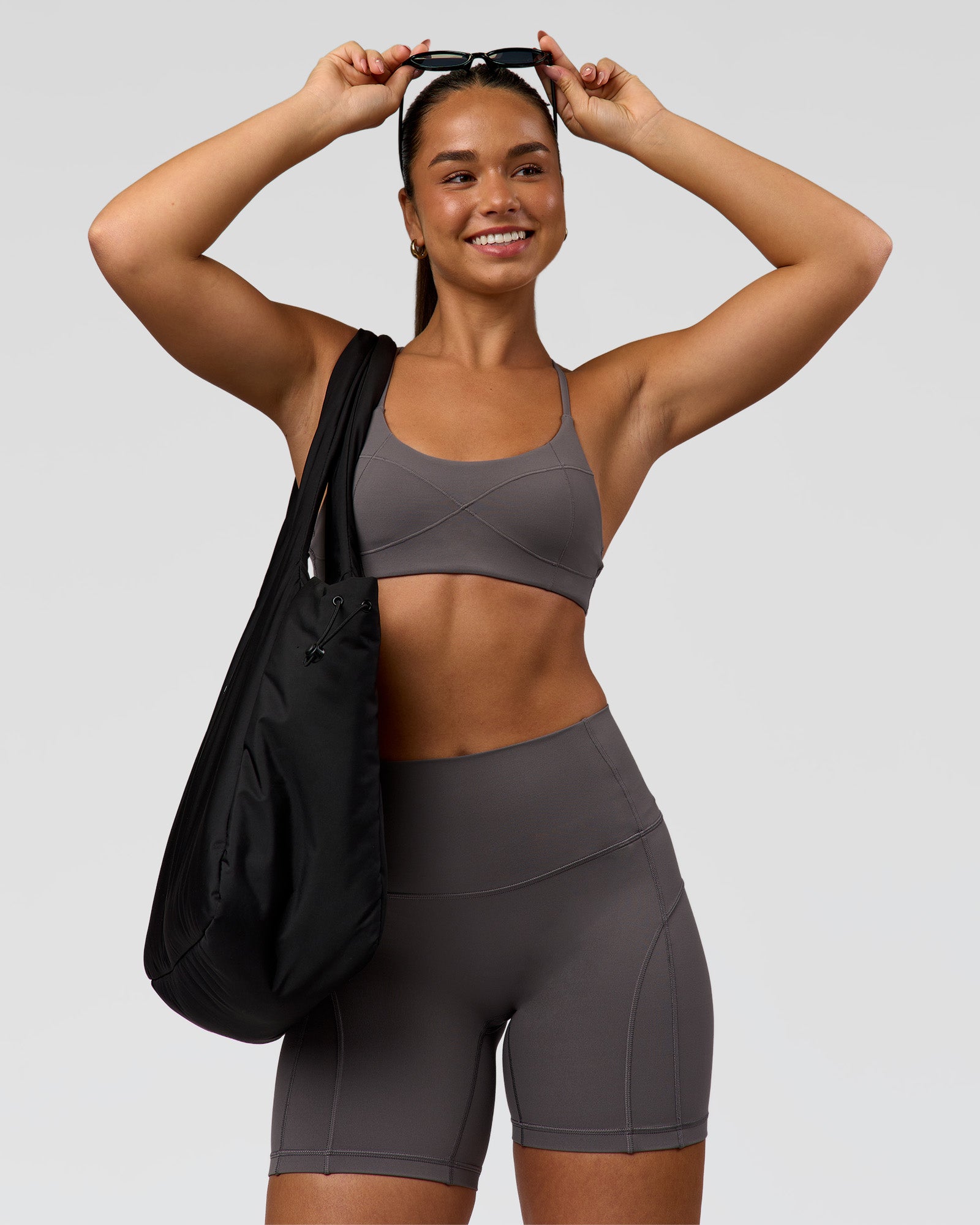Woman wearing Infinite Contour Sports Bra - Duskstone | Model:Rosie | Size:S