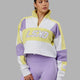 Woman wearing Slam 1/4 Zip Sweater - Yellow-Purple