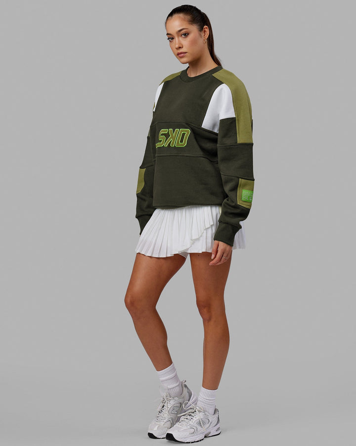 Woman wearing Unisex Slam Sweater Oversize - Forest Night-Moss Stone