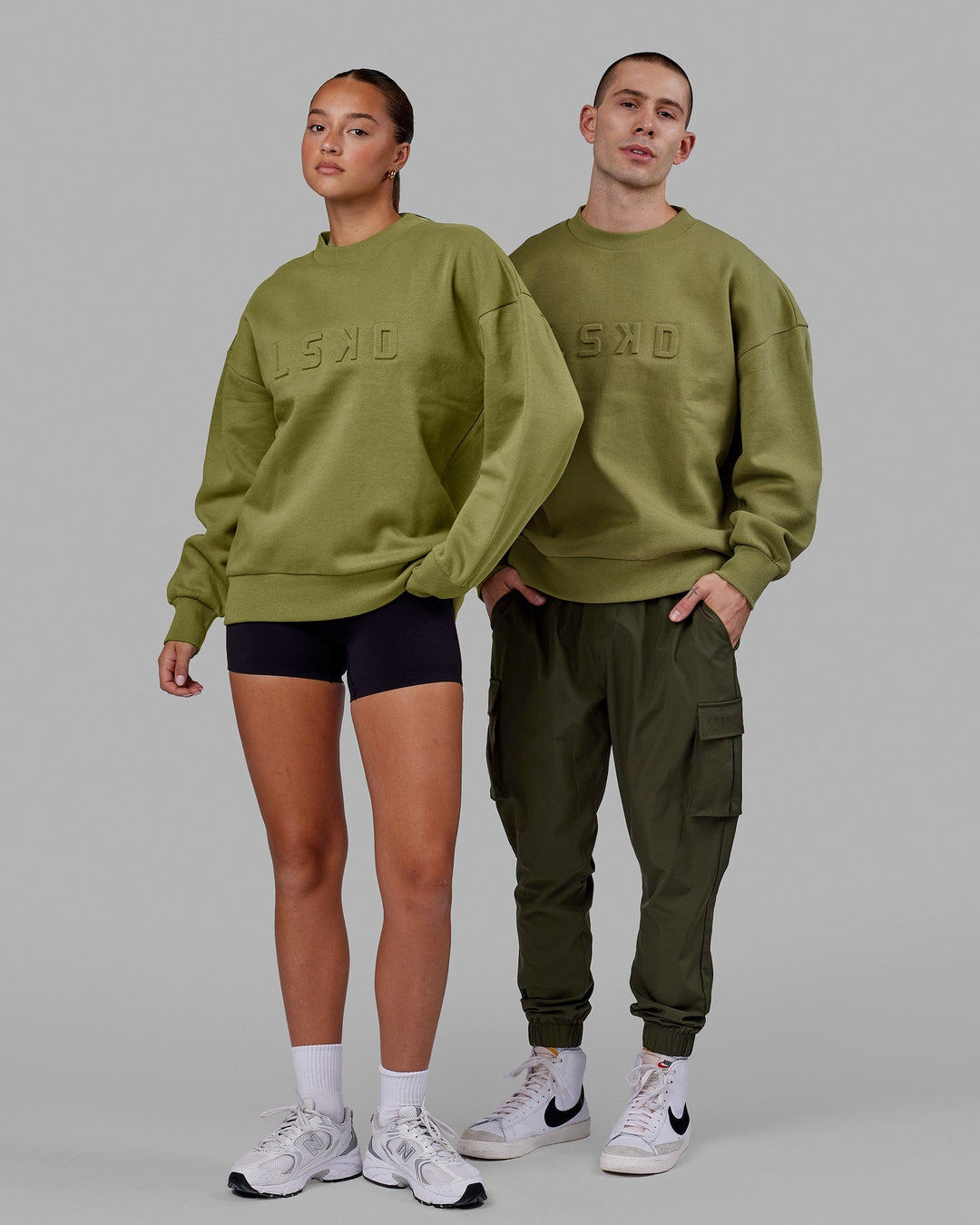 Duo wearing Unisex Stamped Sweater Oversize - Moss Stone