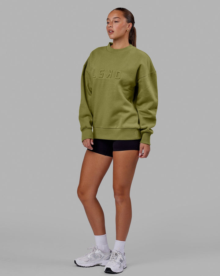 Woman wearing Unisex Stamped Sweater Oversize - Moss Stone