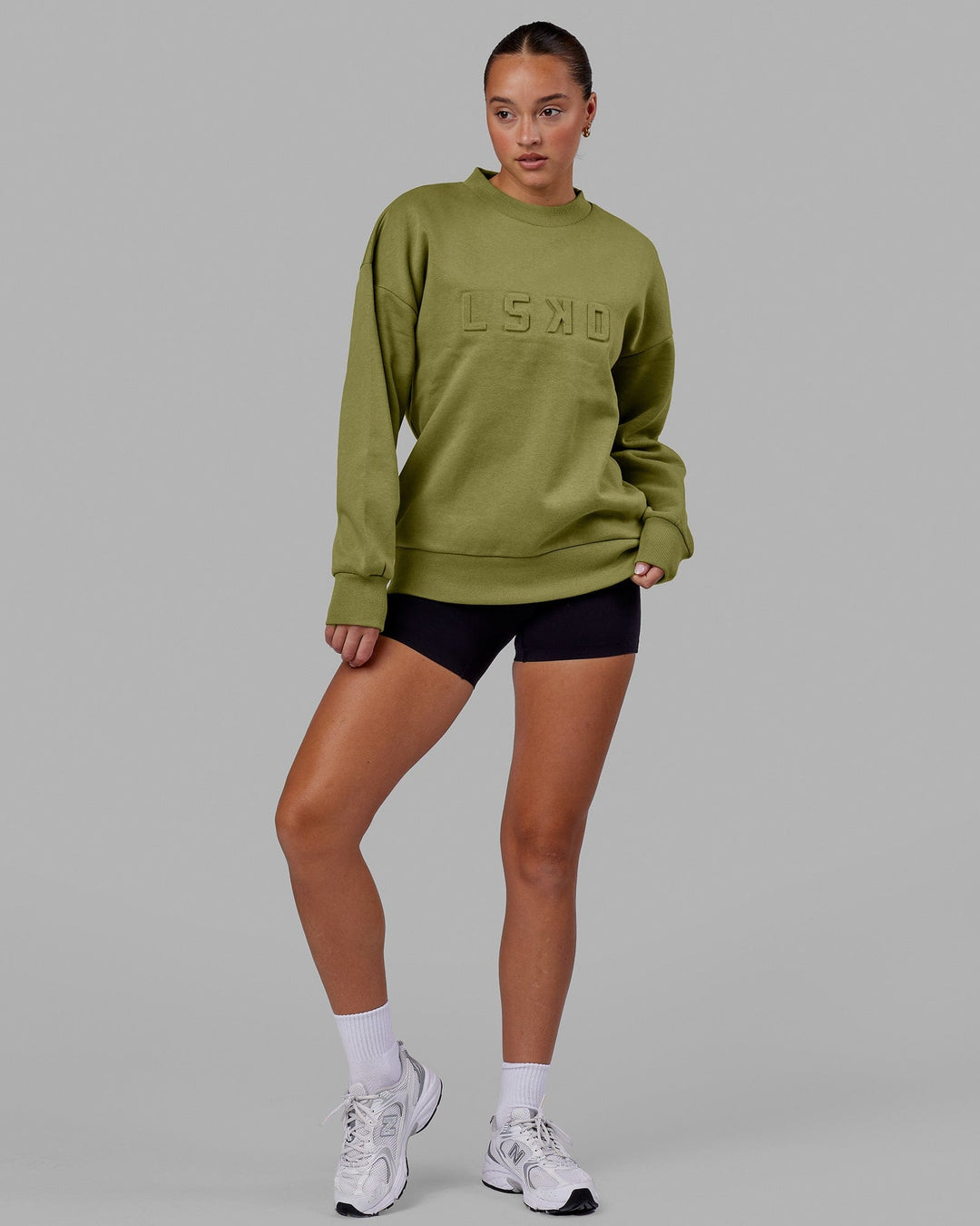 Woman wearing Unisex Stamped Sweater Oversize - Moss Stone