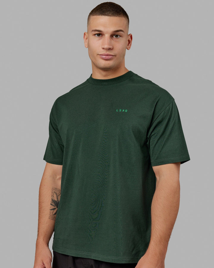 Man wearing Unisex VS2 FLXCotton Tee Oversize - Vital Green-Teal