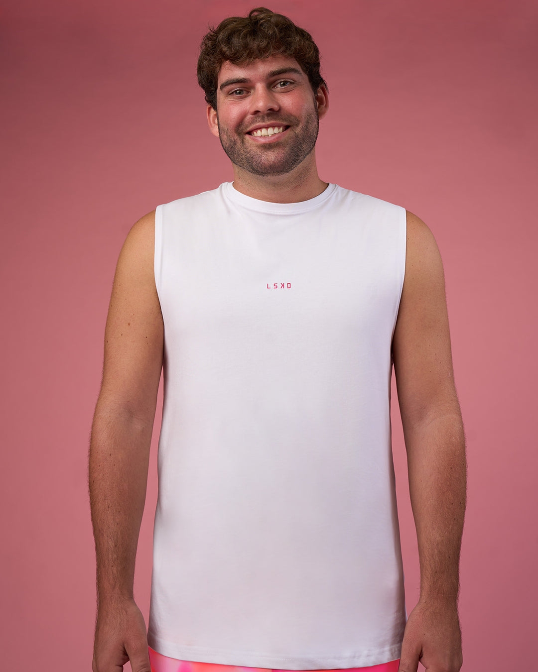 Man wearing BCAM FLXCotton Muscle Tank - White-Ultra Pink | Model:Fletcher | Size:XL