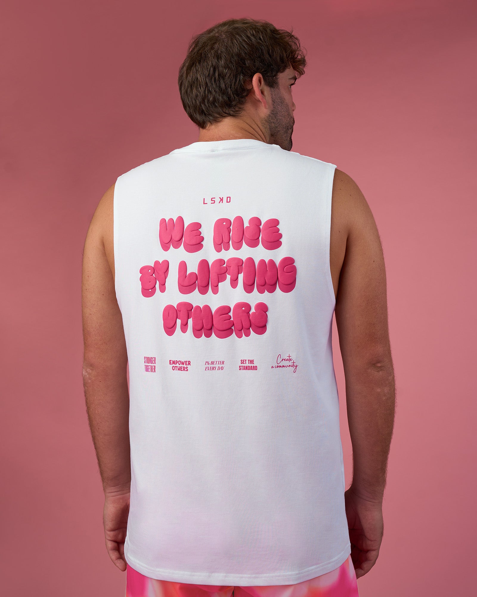 Man wearing BCAM FLXCotton Muscle Tank - White-Ultra Pink | Model:Fletcher | Size:XL