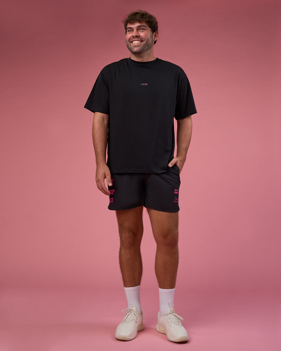 Man wearing BCAM FLXCotton Oversized Tee - Black-Ultra Pink | Model:Fletcher | Size:XL